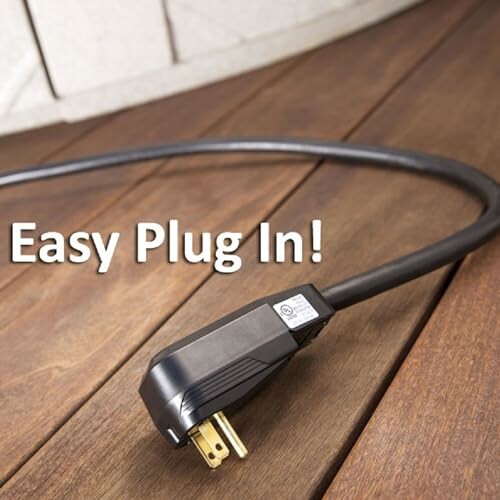 Power cable with easy plug in text on wooden floor.