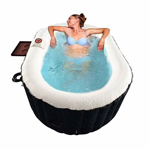 Person relaxing in an inflatable hot tub.